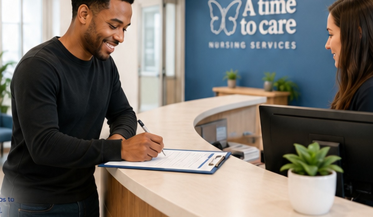 Person completing an application at the front desk